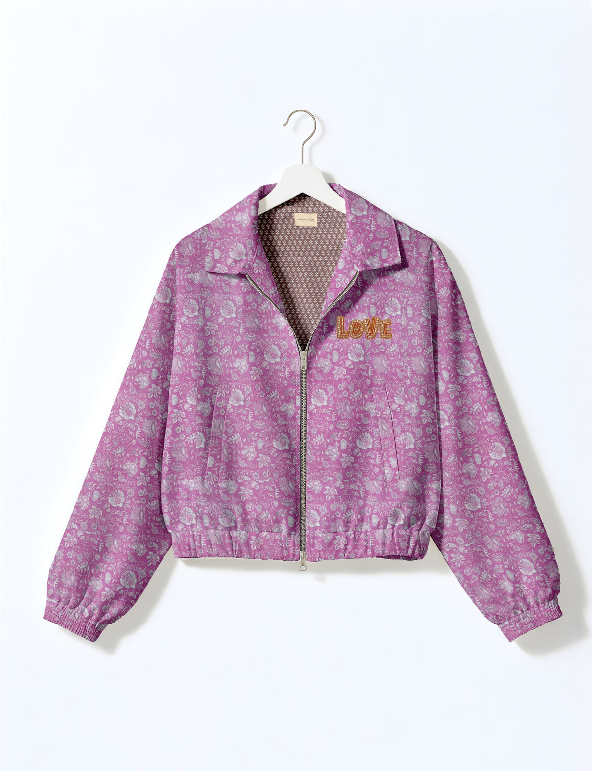 Love Bomber Jacket made from recycled fabric, featuring hand-stitched Aari embroidery. A unique piece of zero-waste clothing, part of the circular fashion movement. Designed with upcycled materials for a stylish yet environmentally friendly clothing choice.
