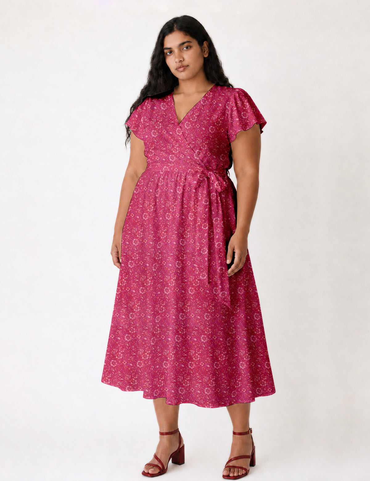 Elegant midi wrap dress with a V-neckline, adjustable waist tie, fitted bodice, and flared skirt for a timeless, flattering silhouette.