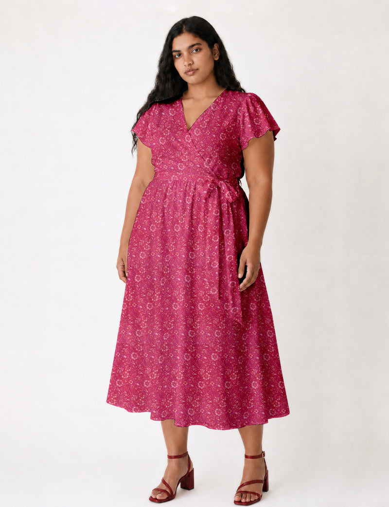 Elegant midi wrap dress with a V-neckline, adjustable waist tie, fitted bodice, and flared skirt for a timeless, flattering silhouette.