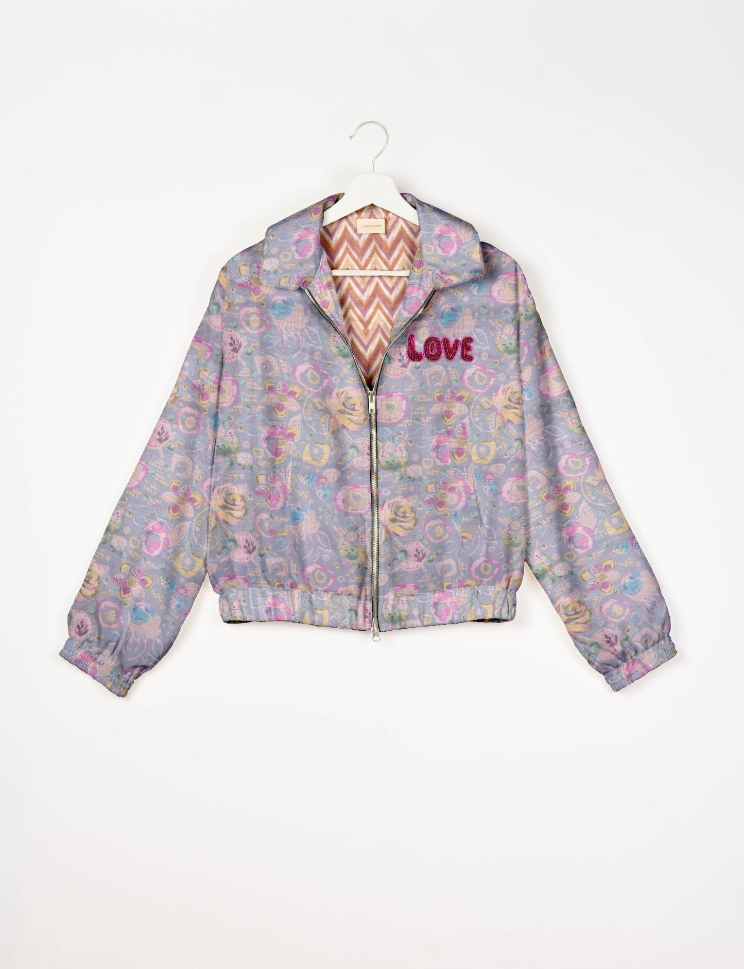 Love Bomber Jacket made from recycled fabric, featuring hand-stitched Aari embroidery. A unique piece of zero-waste clothing, part of the circular fashion movement. Designed with upcycled materials for a stylish yet environmentally friendly clothing choice.