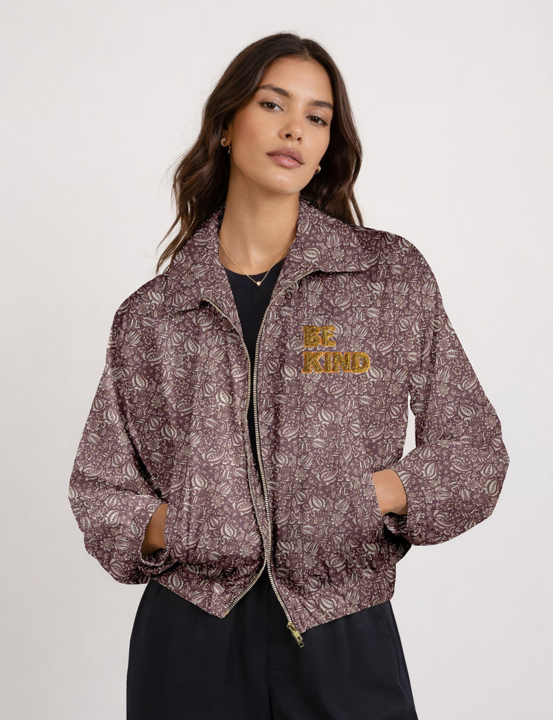 BE KIND Bomber jacket made from upcycled sari fabric with handcrafted Aari embroidery by female artisans.
