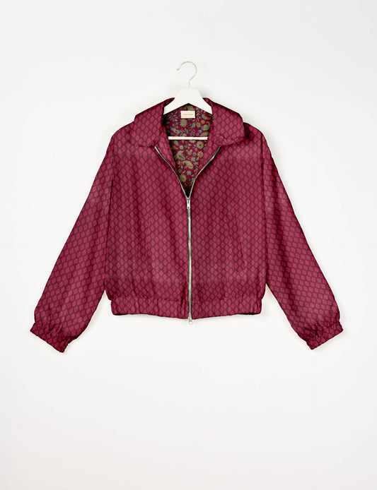 Upcycled Bomber Jacket made from recycled sari materials, featuring a cute cropped shape, elasticated hem and cuffs, and contrast sari print lining. Sustainable apparel promoting eco-friendly fashion and ethical clothing.