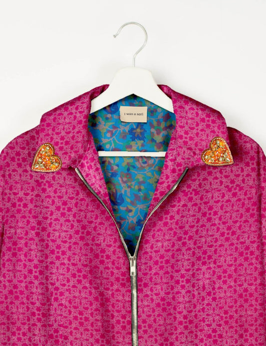 Make a bold statement with our Heart Drop Earrings, a symbol of conscious luxury and ethical fashion. Handcrafted using the intricate Aari embroidery technique, these earrings are made from upcycled sari fabric, embracing slow fashion and zero waste clothing. Elevate your look with sustainable apparel that supports fair trade fashion while reducing textile waste. Choose eco-friendly fashion that speaks of love, artistry, and responsibility.