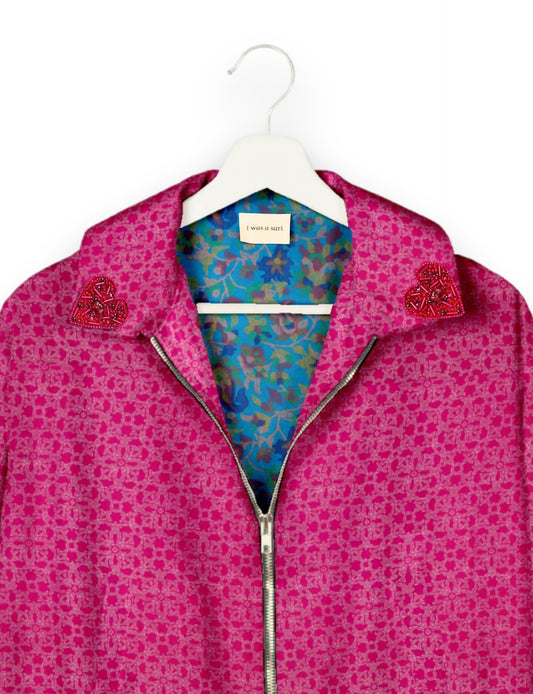 Make a bold statement with our Heart Drop Earrings, a symbol of conscious luxury and ethical fashion. Handcrafted using the intricate Aari embroidery technique, these earrings are made from upcycled sari fabric, embracing slow fashion and zero waste clothing. Elevate your look with sustainable apparel that supports fair trade fashion while reducing textile waste. Choose eco-friendly fashion that speaks of love, artistry, and responsibility.