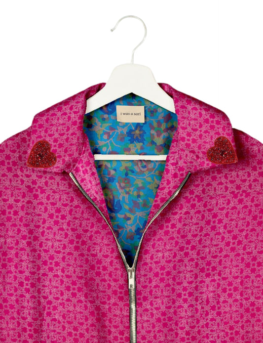 Make a bold statement with our Heart Drop Earrings, a symbol of conscious luxury and ethical fashion. Handcrafted using the intricate Aari embroidery technique, these earrings are made from upcycled sari fabric, embracing slow fashion and zero waste clothing. Elevate your look with sustainable apparel that supports fair trade fashion while reducing textile waste. Choose eco-friendly fashion that speaks of love, artistry, and responsibility.