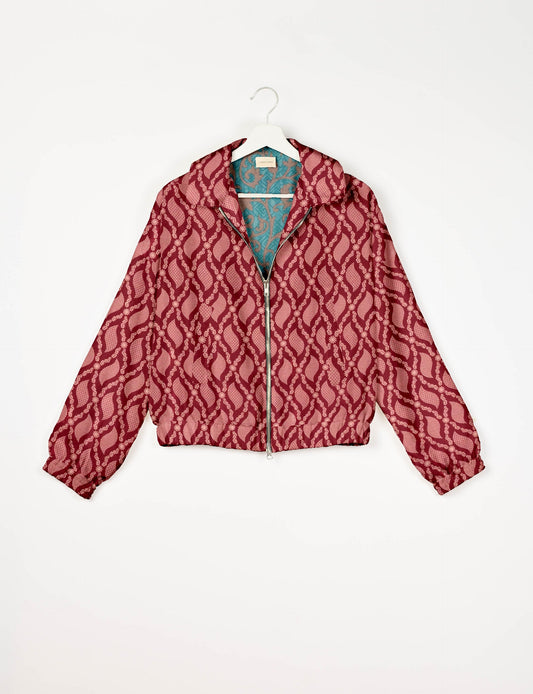 Stylish BOMBER JACKET, an upcycled clothing masterpiece with a cute cropped shape, elasticated details, and detachable metallic zipper. Contrast sari print lining adds a unique touch. Explore sustainable and eco-friendly fashion.