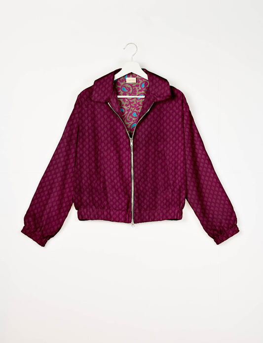Upcycled Bomber Jacket made from recycled sari materials, featuring a cute cropped shape, elasticated hem and cuffs, and contrast sari print lining. Sustainable apparel promoting eco-friendly fashion and ethical clothing.