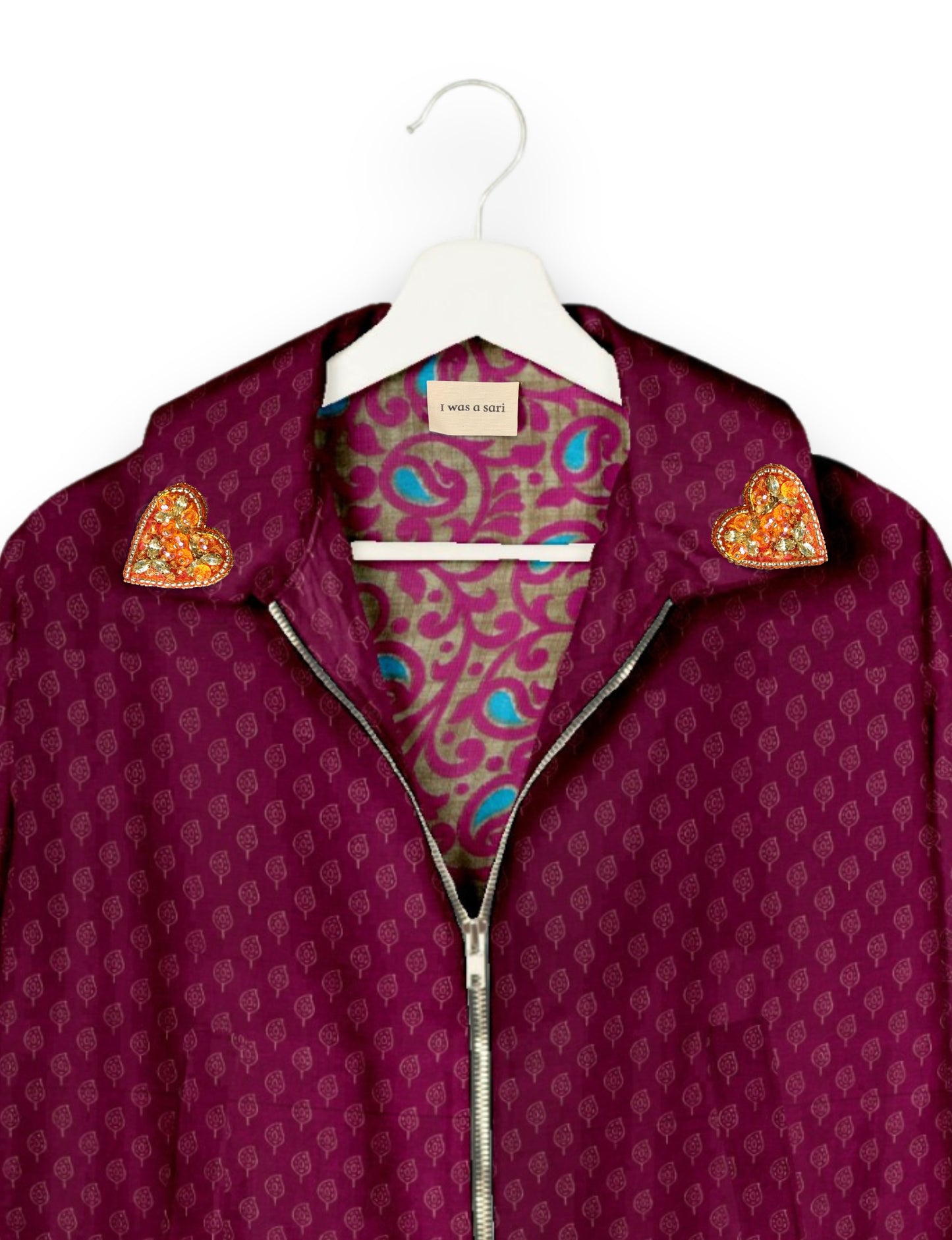 Make a bold statement with our Heart Drop Earrings, a symbol of conscious luxury and ethical fashion. Handcrafted using the intricate Aari embroidery technique, these earrings are made from upcycled sari fabric, embracing slow fashion and zero waste clothing. Elevate your look with sustainable apparel that supports fair trade fashion while reducing textile waste. Choose eco-friendly fashion that speaks of love, artistry, and responsibility.