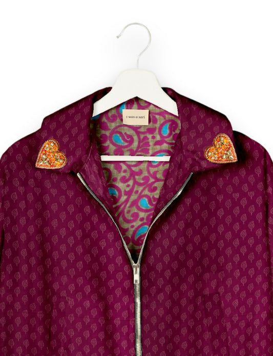 Make a bold statement with our Heart Drop Earrings, a symbol of conscious luxury and ethical fashion. Handcrafted using the intricate Aari embroidery technique, these earrings are made from upcycled sari fabric, embracing slow fashion and zero waste clothing. Elevate your look with sustainable apparel that supports fair trade fashion while reducing textile waste. Choose eco-friendly fashion that speaks of love, artistry, and responsibility.