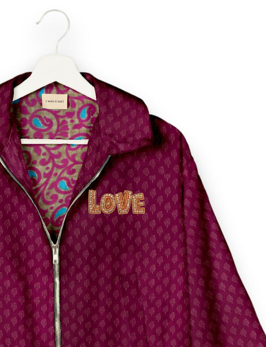Love Bomber Jacket made from recycled fabric, featuring hand-stitched Aari embroidery. A unique piece of zero-waste clothing, part of the circular fashion movement. Designed with upcycled materials for a stylish yet environmentally friendly clothing choice.
