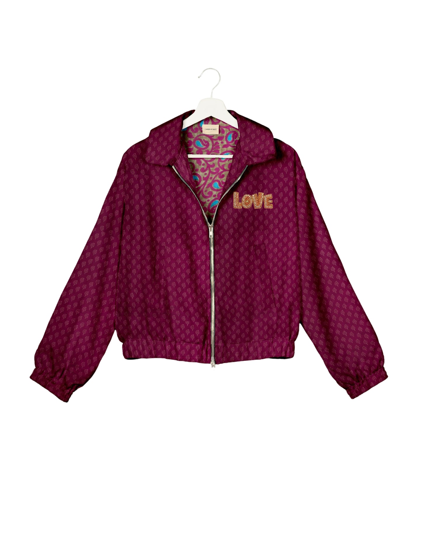 Love Bomber Jacket made from recycled fabric, featuring hand-stitched Aari embroidery. A unique piece of zero-waste clothing, part of the circular fashion movement. Designed with upcycled materials for a stylish yet environmentally friendly clothing choice.