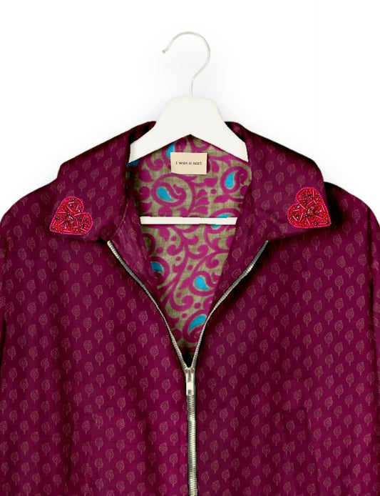 Make a bold statement with our Heart Drop Earrings, a symbol of conscious luxury and ethical fashion. Handcrafted using the intricate Aari embroidery technique, these earrings are made from upcycled sari fabric, embracing slow fashion and zero waste clothing. Elevate your look with sustainable apparel that supports fair trade fashion while reducing textile waste. Choose eco-friendly fashion that speaks of love, artistry, and responsibility.