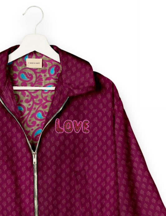 Love Bomber Jacket made from recycled fabric, featuring hand-stitched Aari embroidery. A unique piece of zero-waste clothing, part of the circular fashion movement. Designed with upcycled materials for a stylish yet environmentally friendly clothing choice.