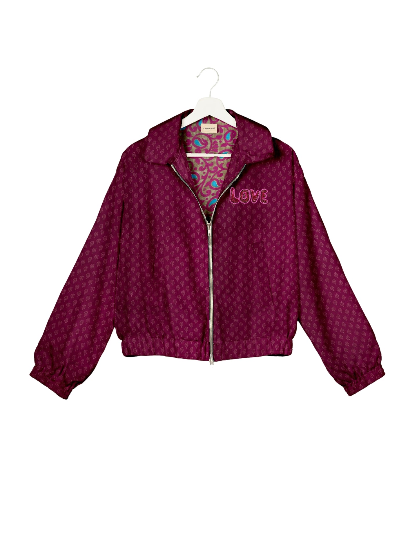 Love Bomber Jacket made from recycled fabric, featuring hand-stitched Aari embroidery. A unique piece of zero-waste clothing, part of the circular fashion movement. Designed with upcycled materials for a stylish yet environmentally friendly clothing choice.