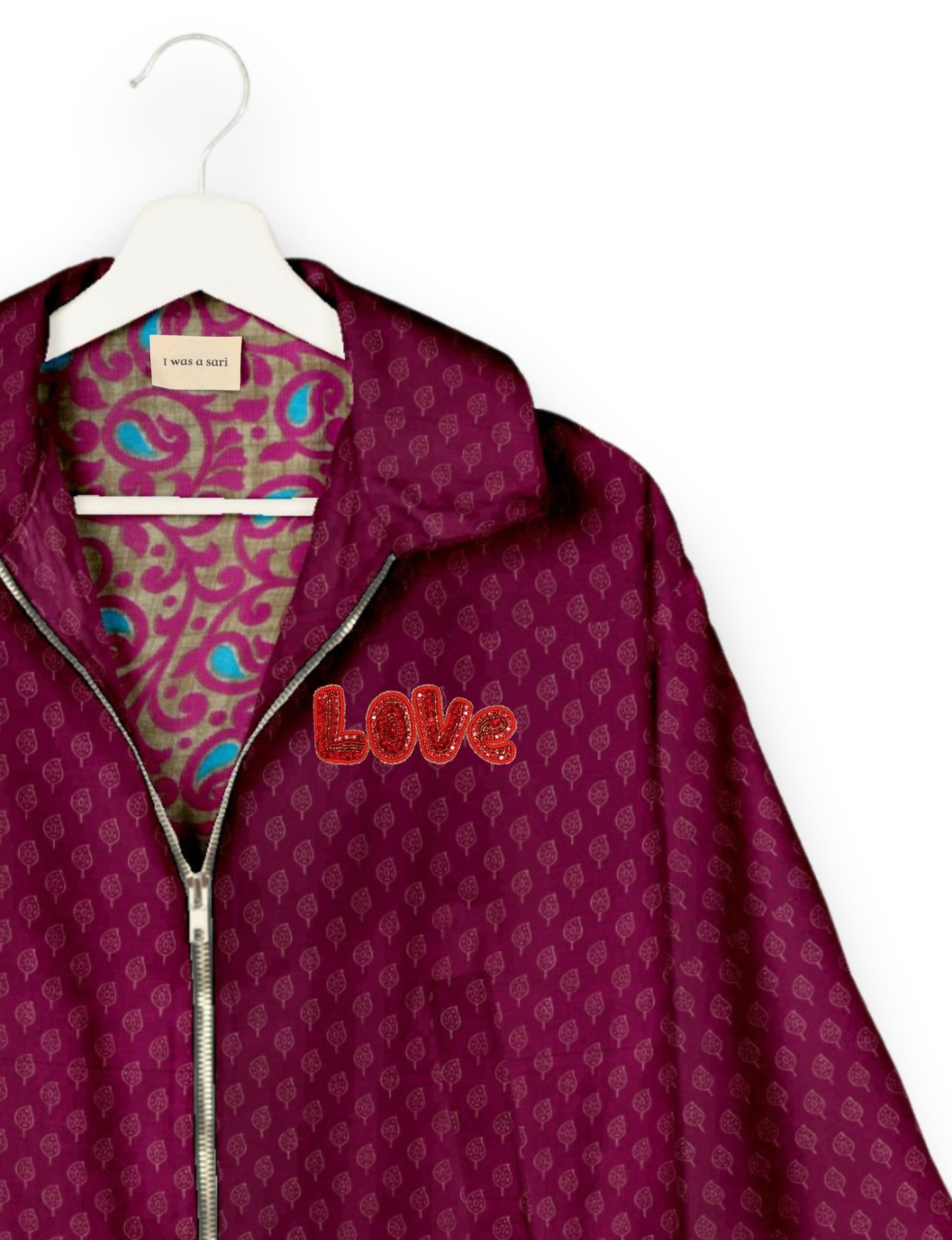 Love Bomber Jacket made from recycled fabric, featuring hand-stitched Aari embroidery. A unique piece of zero-waste clothing, part of the circular fashion movement. Designed with upcycled materials for a stylish yet environmentally friendly clothing choice.