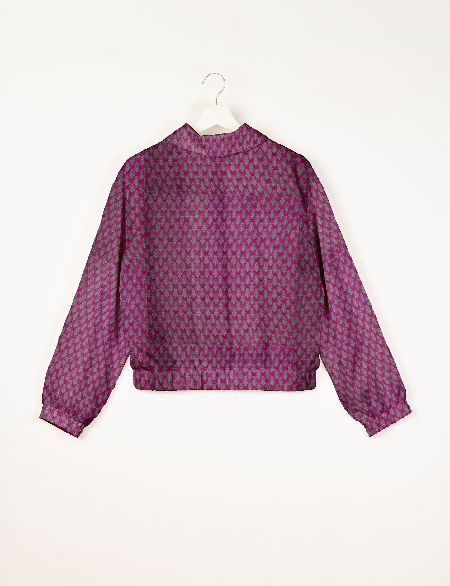 Upcycled Bomber Jacket made from recycled sari materials, featuring a cute cropped shape, elasticated hem and cuffs, and contrast sari print lining. Sustainable apparel promoting eco-friendly fashion and ethical clothing.