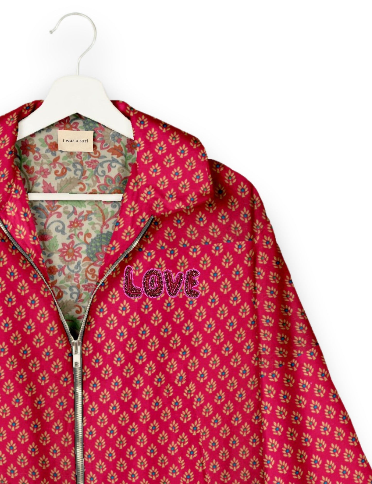 Love Bomber Jacket made from recycled fabric, featuring hand-stitched Aari embroidery. A unique piece of zero-waste clothing, part of the circular fashion movement. Designed with upcycled materials for a stylish yet environmentally friendly clothing choice.