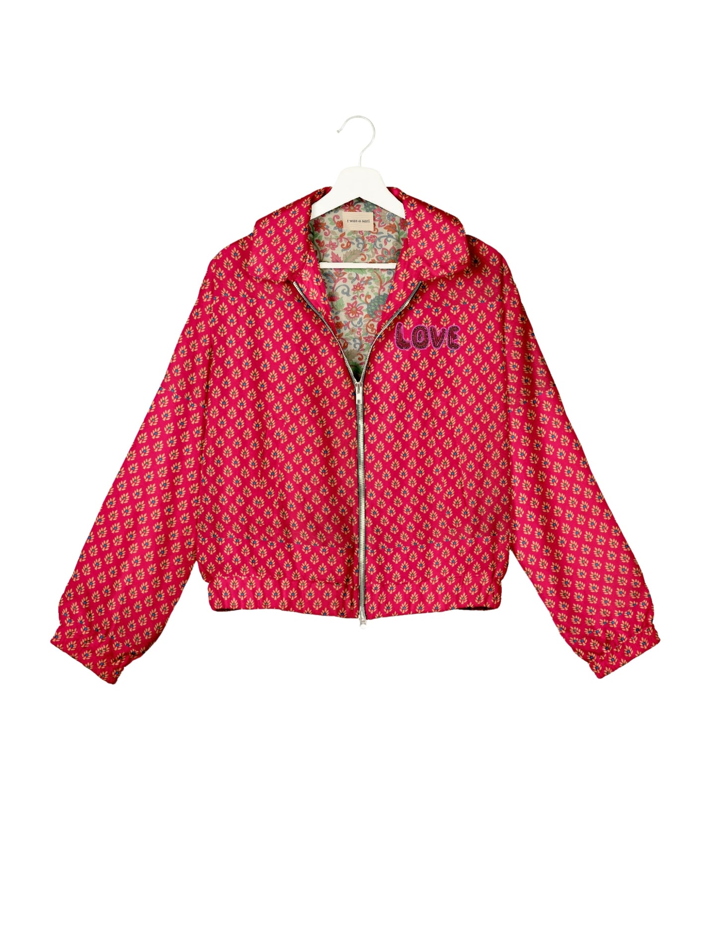 Love Bomber Jacket made from recycled fabric, featuring hand-stitched Aari embroidery. A unique piece of zero-waste clothing, part of the circular fashion movement. Designed with upcycled materials for a stylish yet environmentally friendly clothing choice.