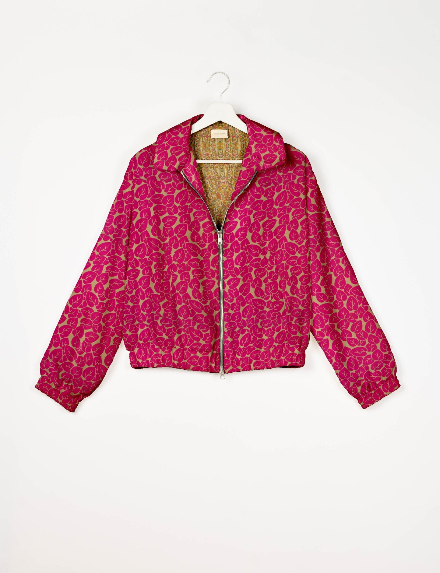 Upcycled Bomber Jacket made from recycled sari materials, featuring a cute cropped shape, elasticated hem and cuffs, and contrast sari print lining. Sustainable apparel promoting eco-friendly fashion and ethical clothing.