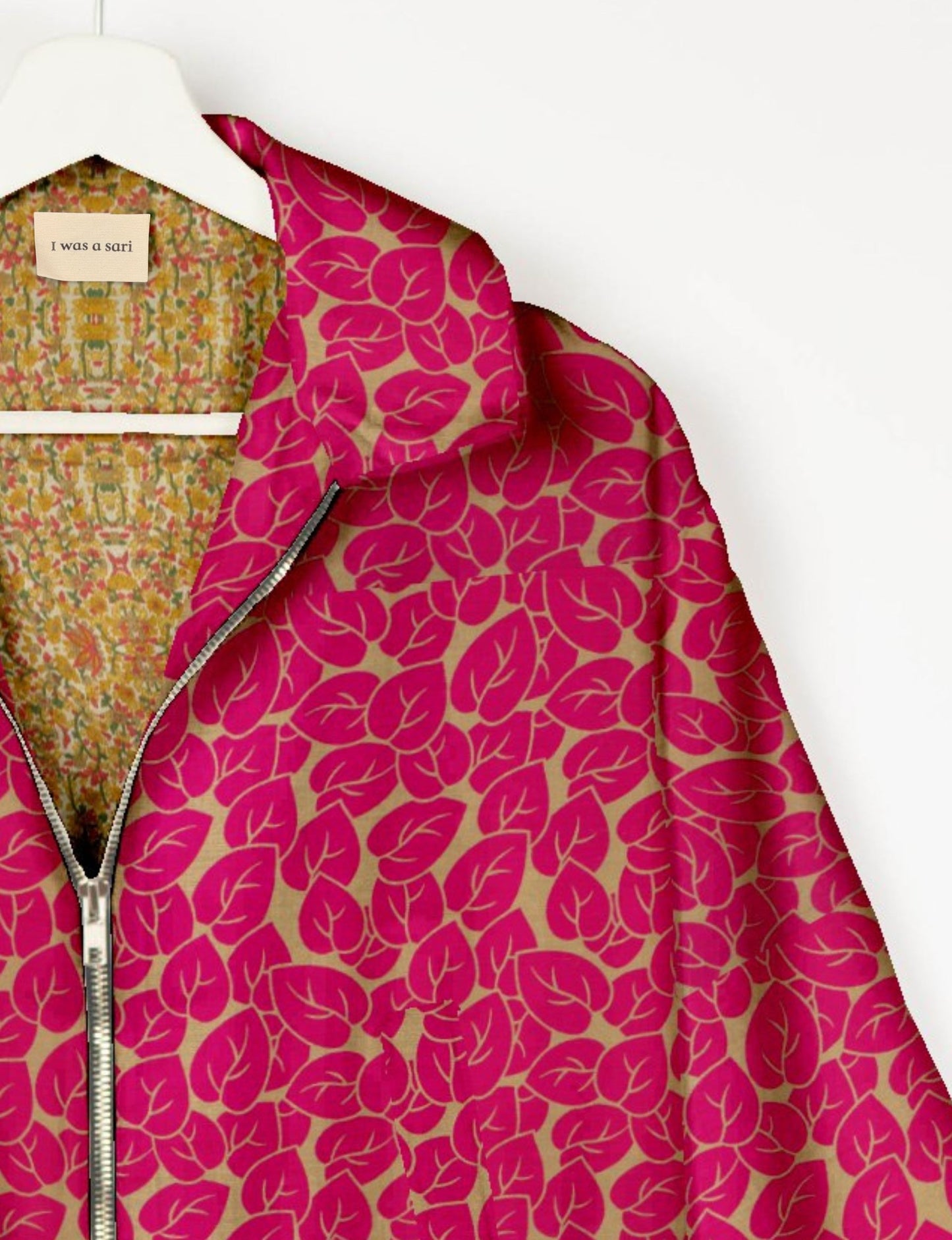 Upcycled Bomber Jacket made from recycled sari materials, featuring a cute cropped shape, elasticated hem and cuffs, and contrast sari print lining. Sustainable apparel promoting eco-friendly fashion and ethical clothing.