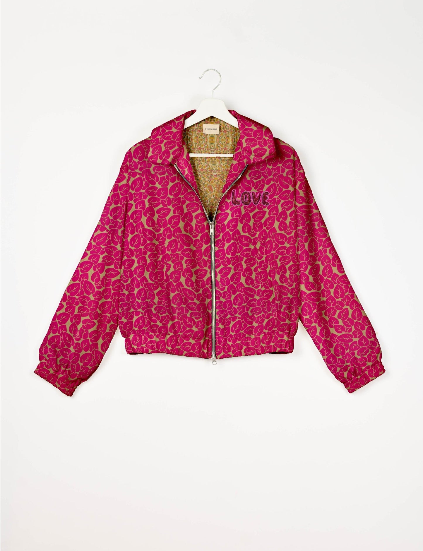 Love Bomber Jacket made from recycled fabric, featuring hand-stitched Aari embroidery. A unique piece of zero-waste clothing, part of the circular fashion movement. Designed with upcycled materials for a stylish yet environmentally friendly clothing choice.