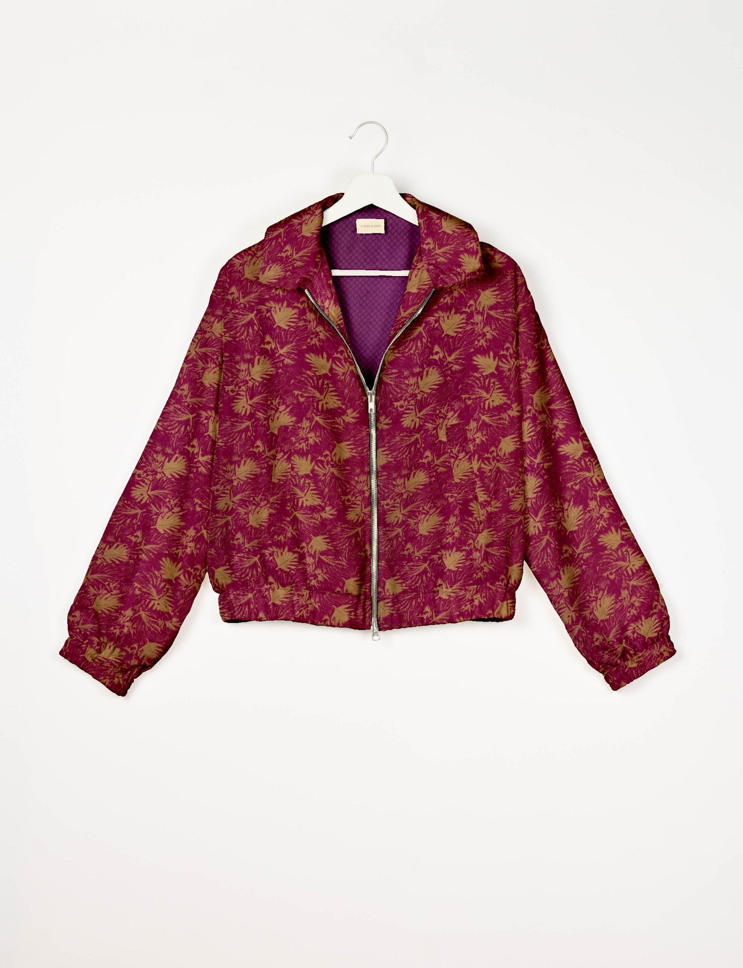 Upcycled Bomber Jacket made from recycled sari materials, featuring a cute cropped shape, elasticated hem and cuffs, and contrast sari print lining. Sustainable apparel promoting eco-friendly fashion and ethical clothing.