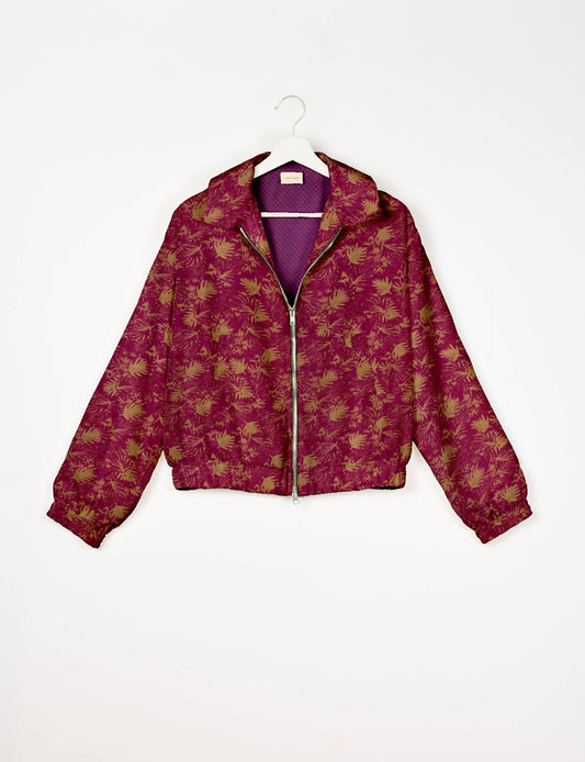 Upcycled Bomber Jacket made from recycled sari materials, featuring a cute cropped shape, elasticated hem and cuffs, and contrast sari print lining. Sustainable apparel promoting eco-friendly fashion and ethical clothing.