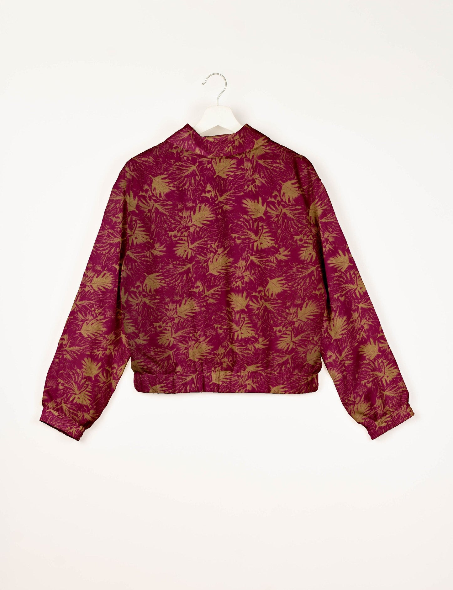 Upcycled Bomber Jacket made from recycled sari materials, featuring a cute cropped shape, elasticated hem and cuffs, and contrast sari print lining. Sustainable apparel promoting eco-friendly fashion and ethical clothing.
