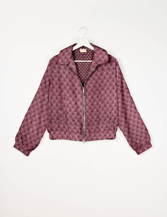 Upcycled Bomber Jacket made from recycled sari materials, featuring a cute cropped shape, elasticated hem and cuffs, and contrast sari print lining. Sustainable apparel promoting eco-friendly fashion and ethical clothing.