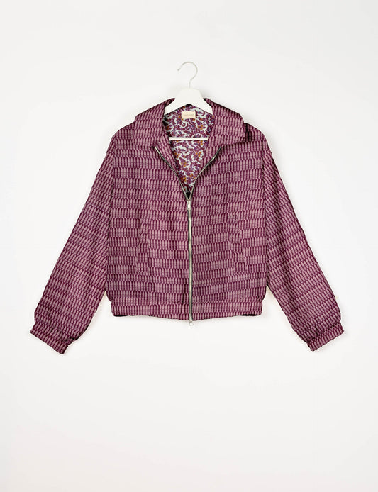 Upcycled Bomber Jacket made from recycled sari materials, featuring a cute cropped shape, elasticated hem and cuffs, and contrast sari print lining. Sustainable apparel promoting eco-friendly fashion and ethical clothing.