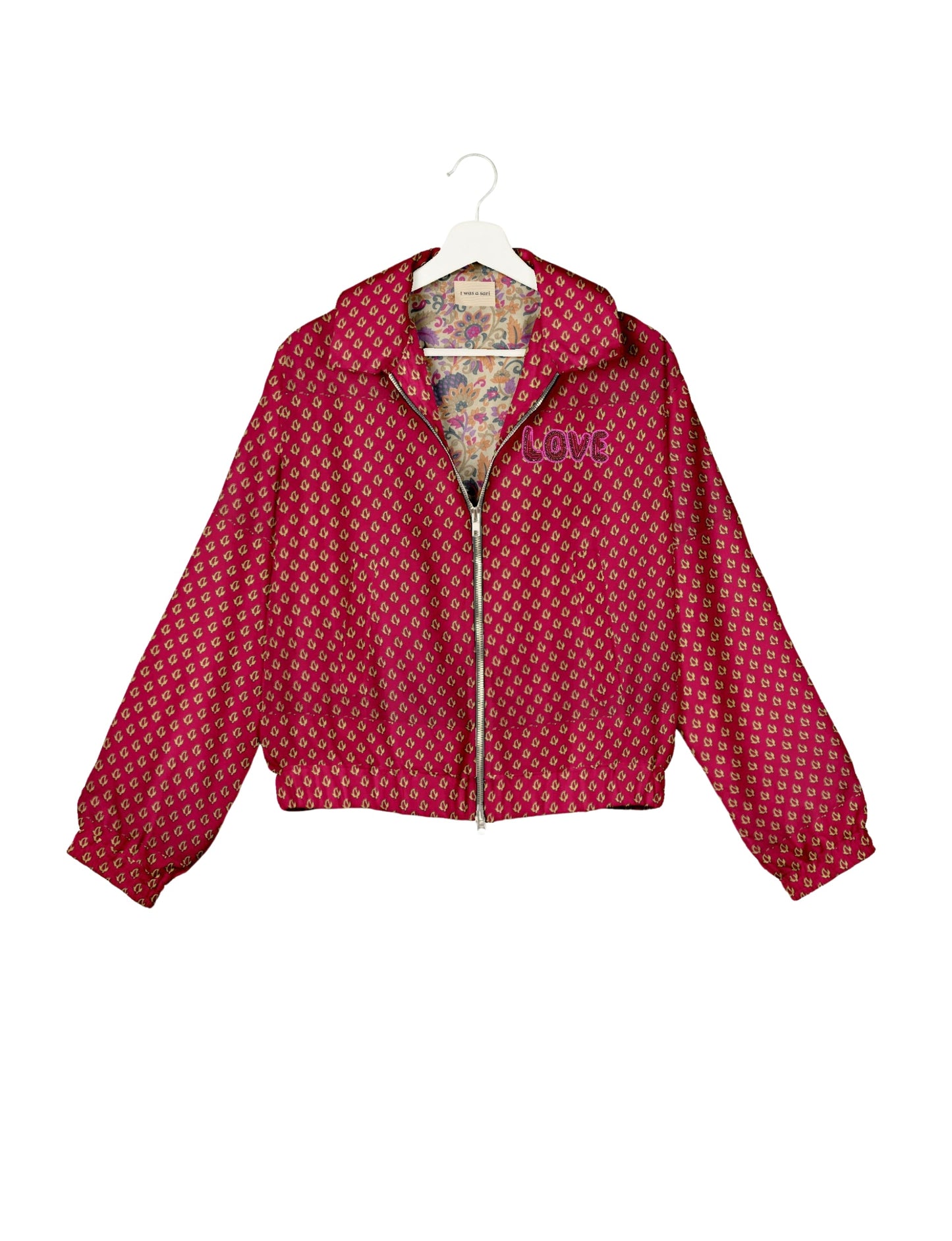 Love Bomber Jacket made from recycled fabric, featuring hand-stitched Aari embroidery. A unique piece of zero-waste clothing, part of the circular fashion movement. Designed with upcycled materials for a stylish yet environmentally friendly clothing choice.