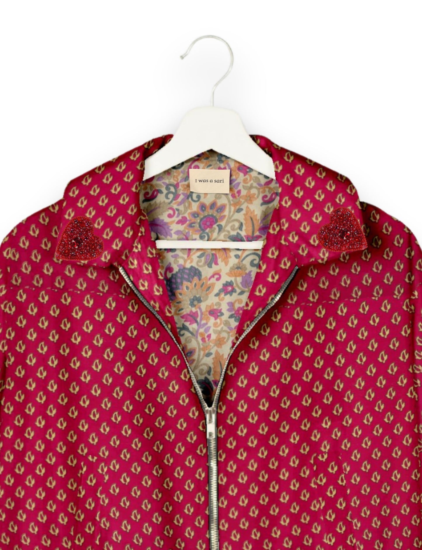 Make a bold statement with our Heart Drop Earrings, a symbol of conscious luxury and ethical fashion. Handcrafted using the intricate Aari embroidery technique, these earrings are made from upcycled sari fabric, embracing slow fashion and zero waste clothing. Elevate your look with sustainable apparel that supports fair trade fashion while reducing textile waste. Choose eco-friendly fashion that speaks of love, artistry, and responsibility.