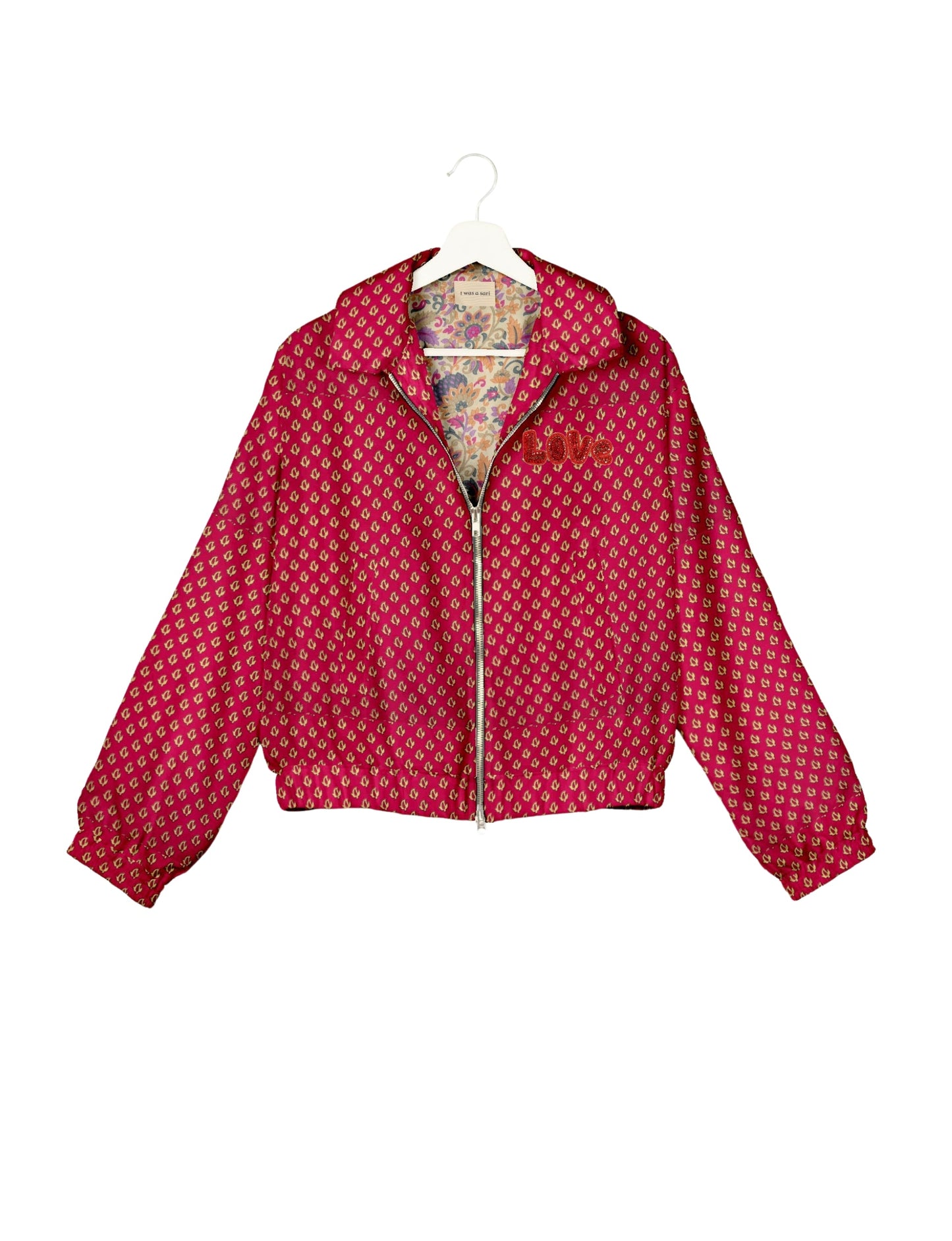 Love Bomber Jacket made from recycled fabric, featuring hand-stitched Aari embroidery. A unique piece of zero-waste clothing, part of the circular fashion movement. Designed with upcycled materials for a stylish yet environmentally friendly clothing choice.