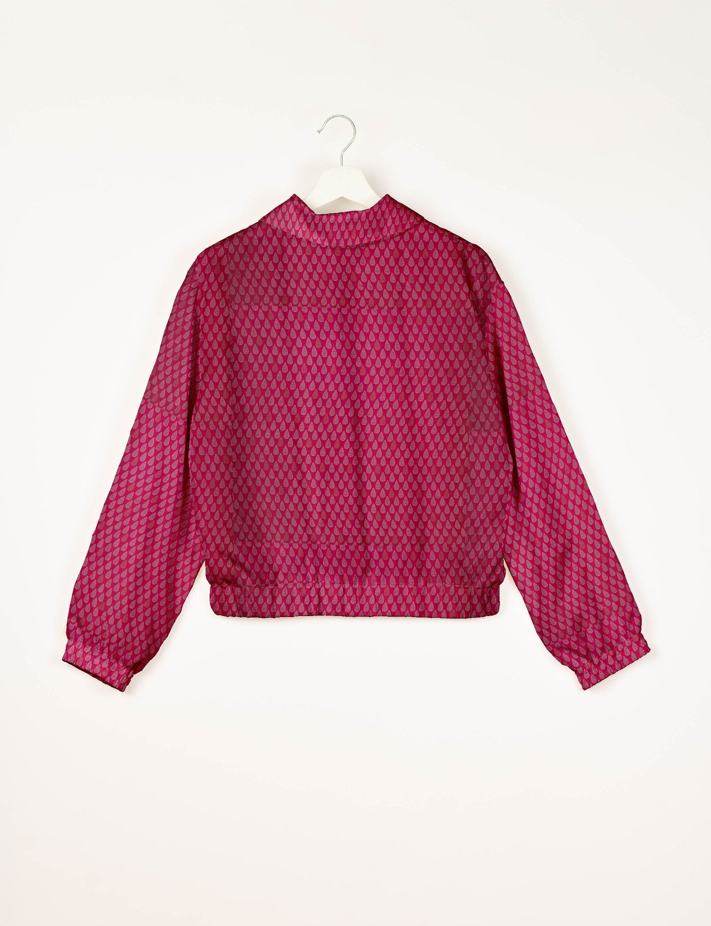 Upcycled Bomber Jacket made from recycled sari materials, featuring a cute cropped shape, elasticated hem and cuffs, and contrast sari print lining. Sustainable apparel promoting eco-friendly fashion and ethical clothing.