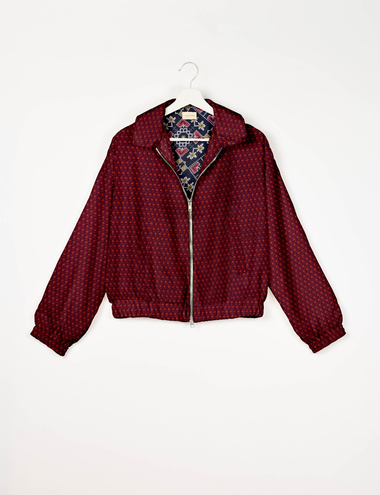 Upcycled Bomber Jacket made from recycled sari materials, featuring a cute cropped shape, elasticated hem and cuffs, and contrast sari print lining. Sustainable apparel promoting eco-friendly fashion and ethical clothing.