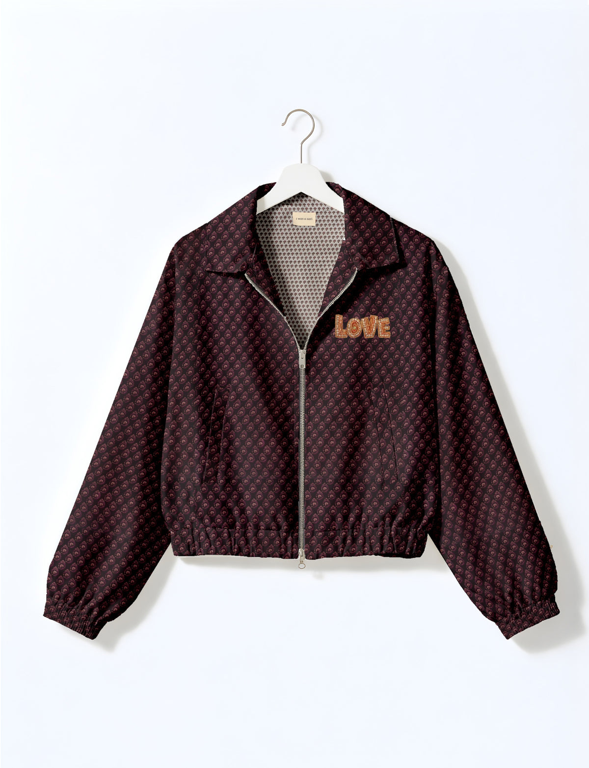 Love Bomber Jacket made from recycled fabric, featuring hand-stitched Aari embroidery. A unique piece of zero-waste clothing, part of the circular fashion movement. Designed with upcycled materials for a stylish yet environmentally friendly clothing choice.