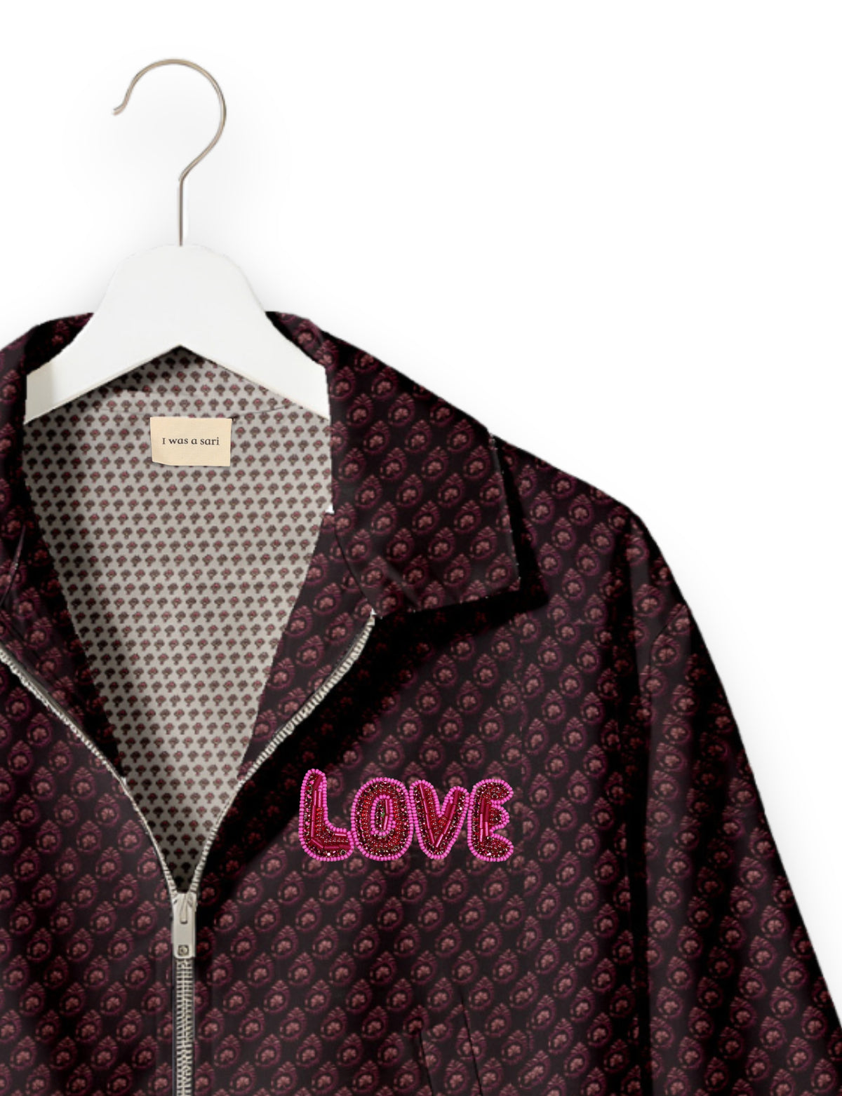 Love Bomber Jacket made from recycled fabric, featuring hand-stitched Aari embroidery. A unique piece of zero-waste clothing, part of the circular fashion movement. Designed with upcycled materials for a stylish yet environmentally friendly clothing choice.