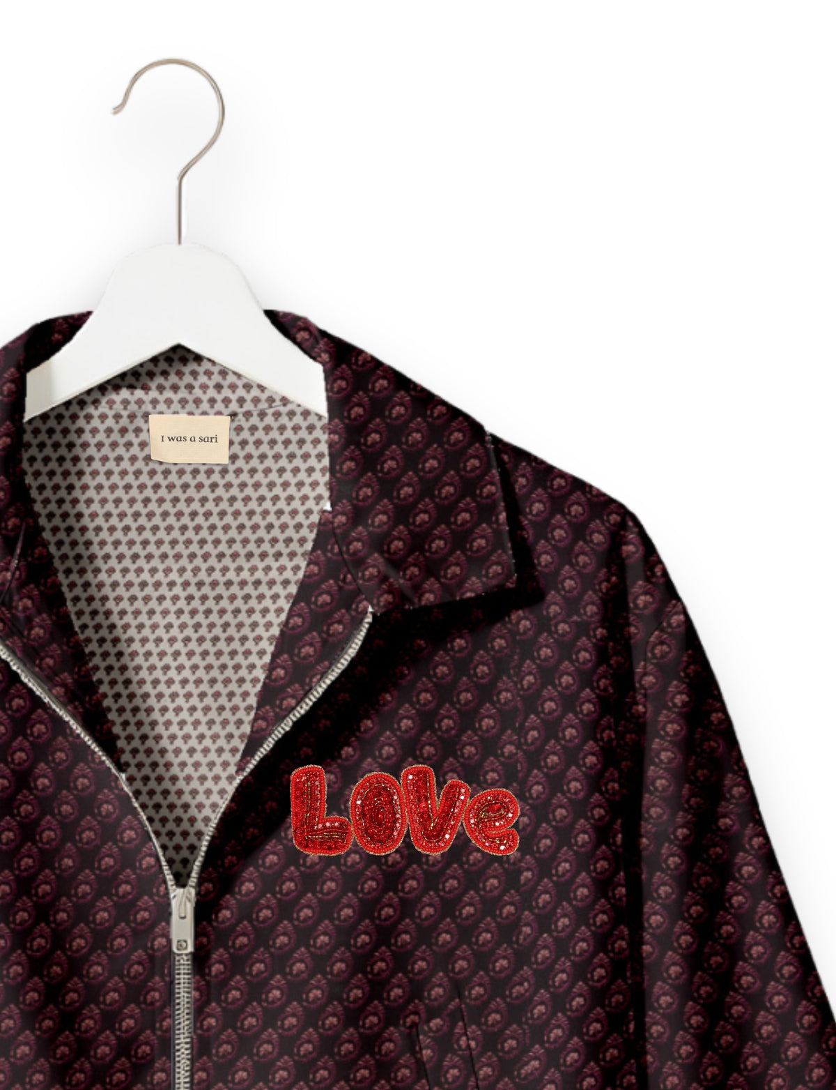 Love Bomber Jacket made from recycled fabric, featuring hand-stitched Aari embroidery. A unique piece of zero-waste clothing, part of the circular fashion movement. Designed with upcycled materials for a stylish yet environmentally friendly clothing choice.