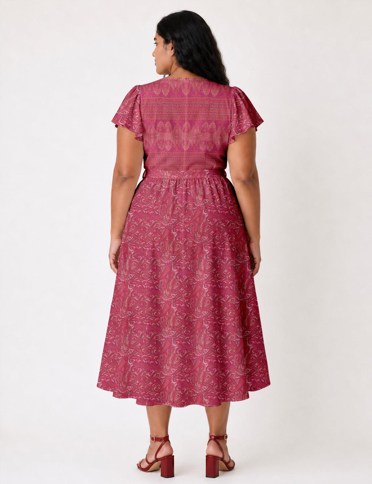 Elegant midi wrap dress with a V-neckline, adjustable waist tie, fitted bodice, and flared skirt for a timeless, flattering silhouette.