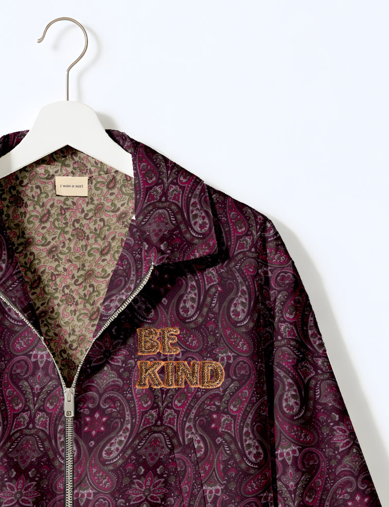 BE KIND Bomber jacket made from upcycled sari fabric with handcrafted Aari embroidery by female artisans.