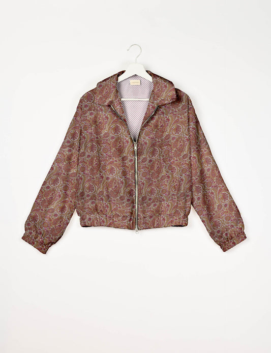 Upcycled Bomber Jacket made from recycled sari materials, featuring a cute cropped shape, elasticated hem and cuffs, and contrast sari print lining. Sustainable apparel promoting eco-friendly fashion and ethical clothing.