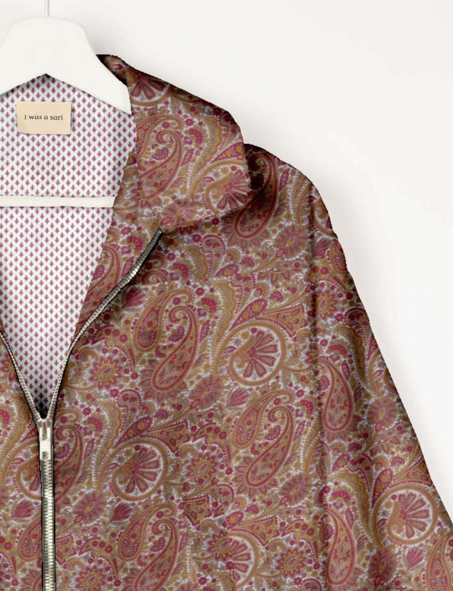 Upcycled Bomber Jacket made from recycled sari materials, featuring a cute cropped shape, elasticated hem and cuffs, and contrast sari print lining. Sustainable apparel promoting eco-friendly fashion and ethical clothing.