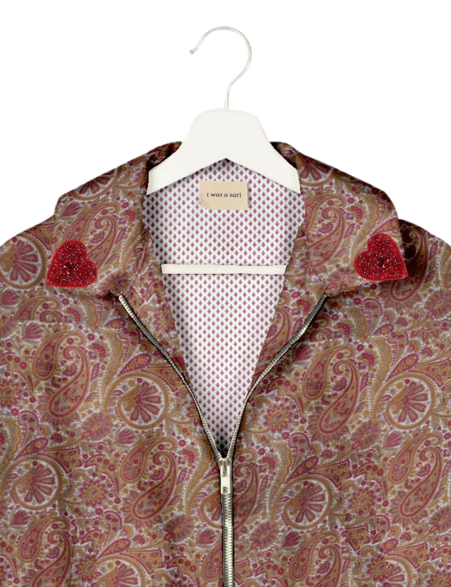 Make a bold statement with our Heart Drop Earrings, a symbol of conscious luxury and ethical fashion. Handcrafted using the intricate Aari embroidery technique, these earrings are made from upcycled sari fabric, embracing slow fashion and zero waste clothing. Elevate your look with sustainable apparel that supports fair trade fashion while reducing textile waste. Choose eco-friendly fashion that speaks of love, artistry, and responsibility.