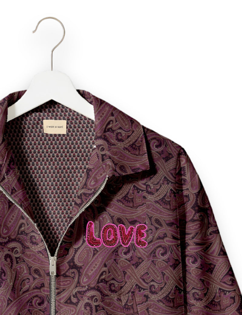 Love Bomber Jacket made from recycled fabric, featuring hand-stitched Aari embroidery. A unique piece of zero-waste clothing, part of the circular fashion movement. Designed with upcycled materials for a stylish yet environmentally friendly clothing choice.