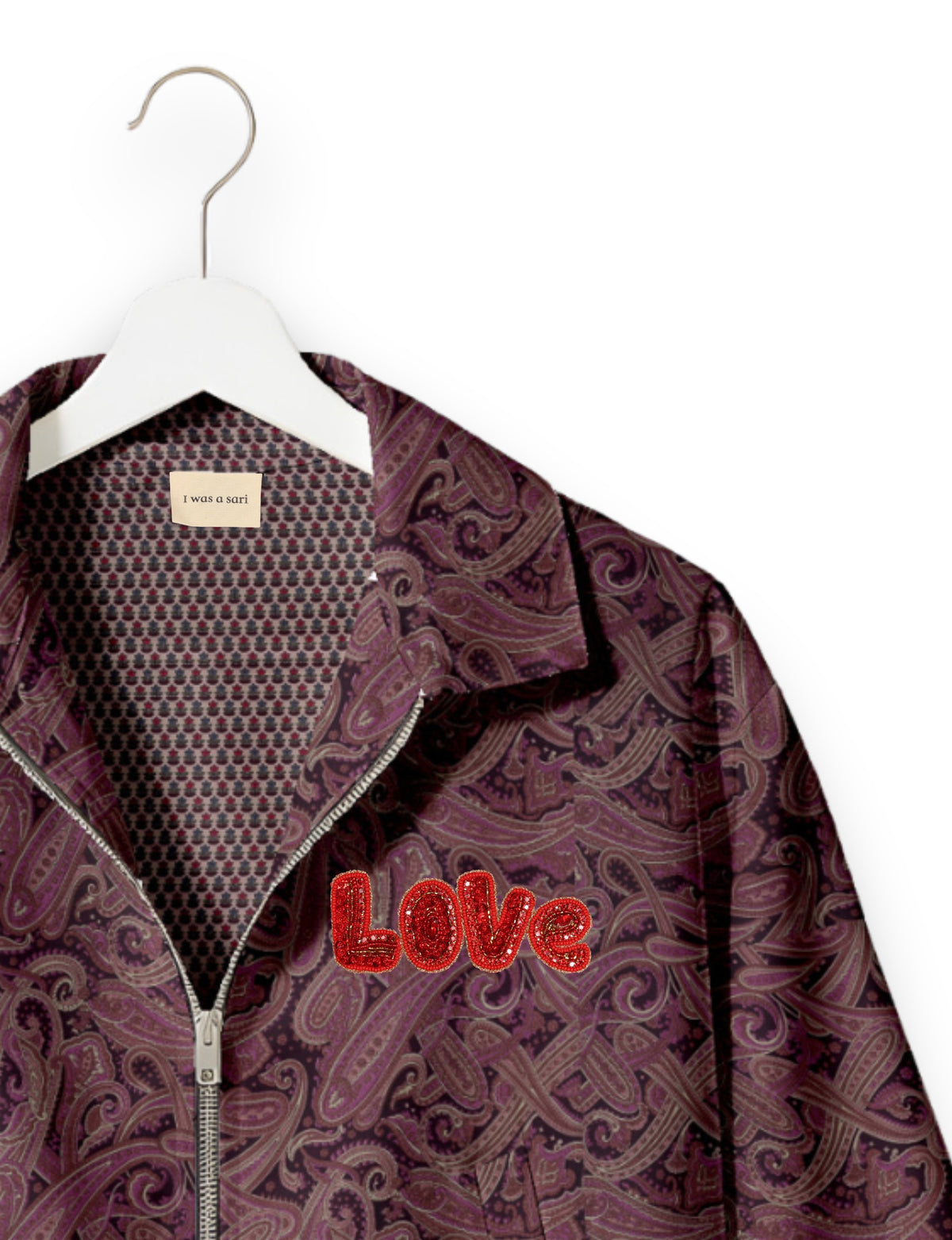 Love Bomber Jacket made from recycled fabric, featuring hand-stitched Aari embroidery. A unique piece of zero-waste clothing, part of the circular fashion movement. Designed with upcycled materials for a stylish yet environmentally friendly clothing choice.