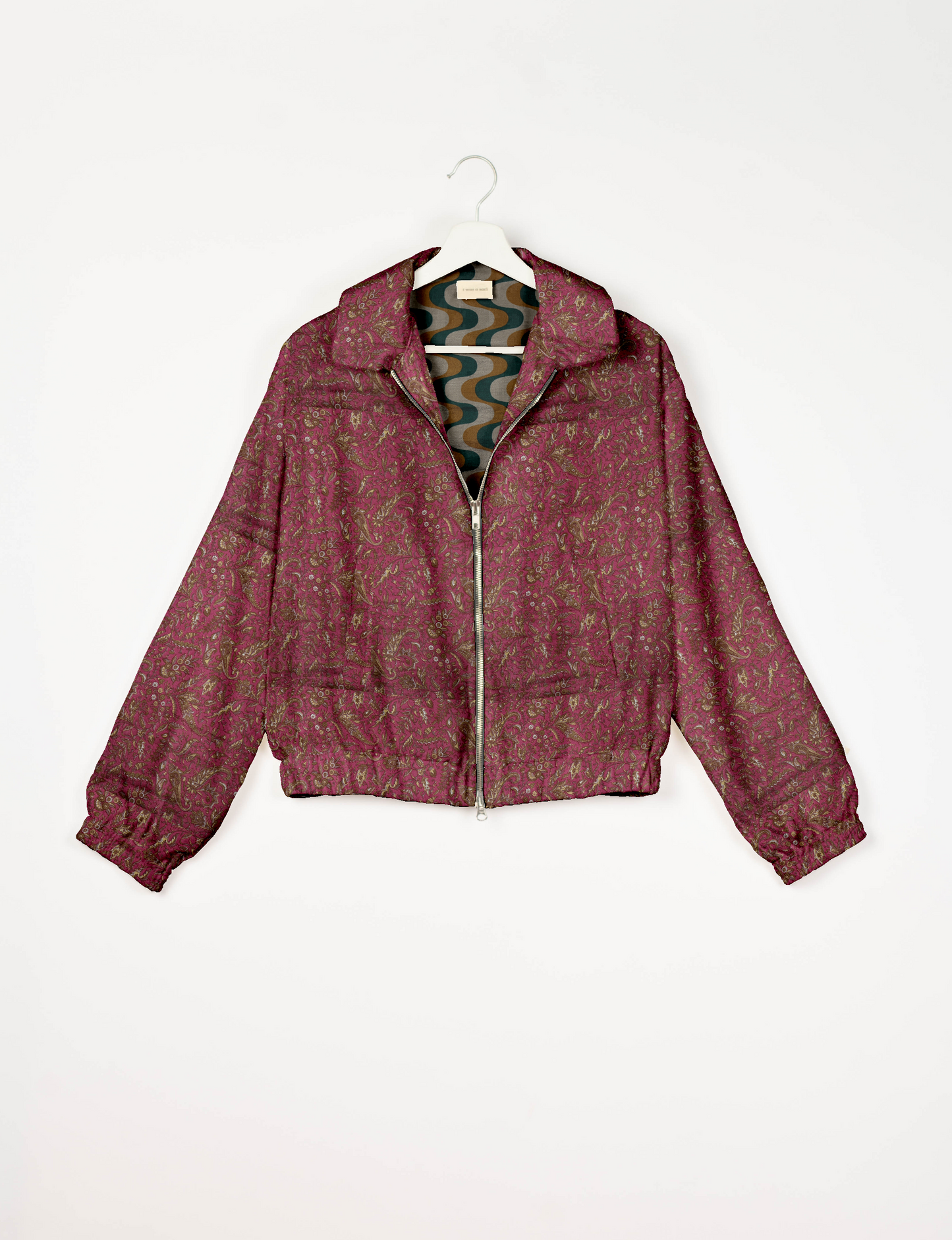 Upcycled Bomber Jacket made from recycled sari materials, featuring a cute cropped shape, elasticated hem and cuffs, and contrast sari print lining. Sustainable apparel promoting eco-friendly fashion and ethical clothing.