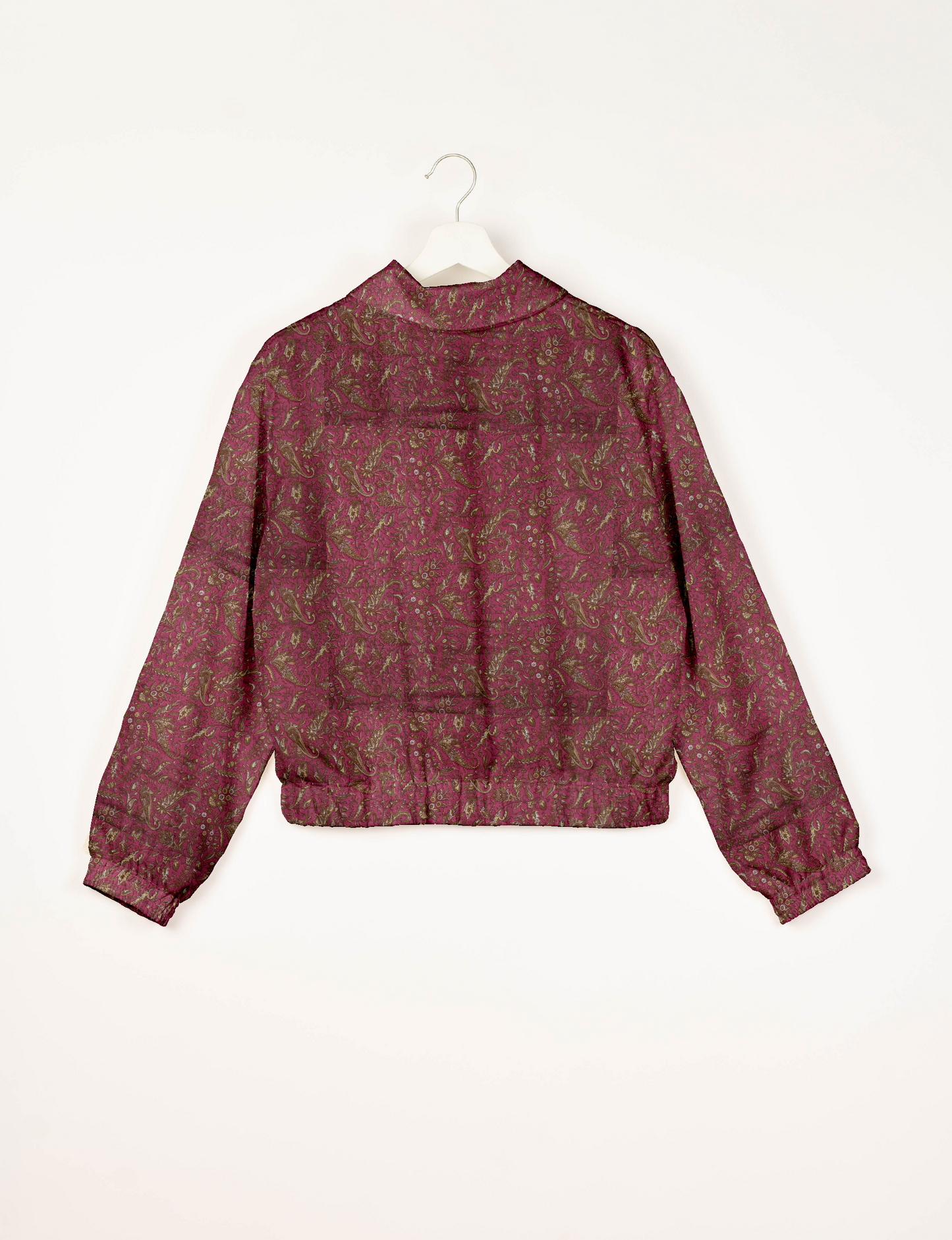 Upcycled Bomber Jacket made from recycled sari materials, featuring a cute cropped shape, elasticated hem and cuffs, and contrast sari print lining. Sustainable apparel promoting eco-friendly fashion and ethical clothing.