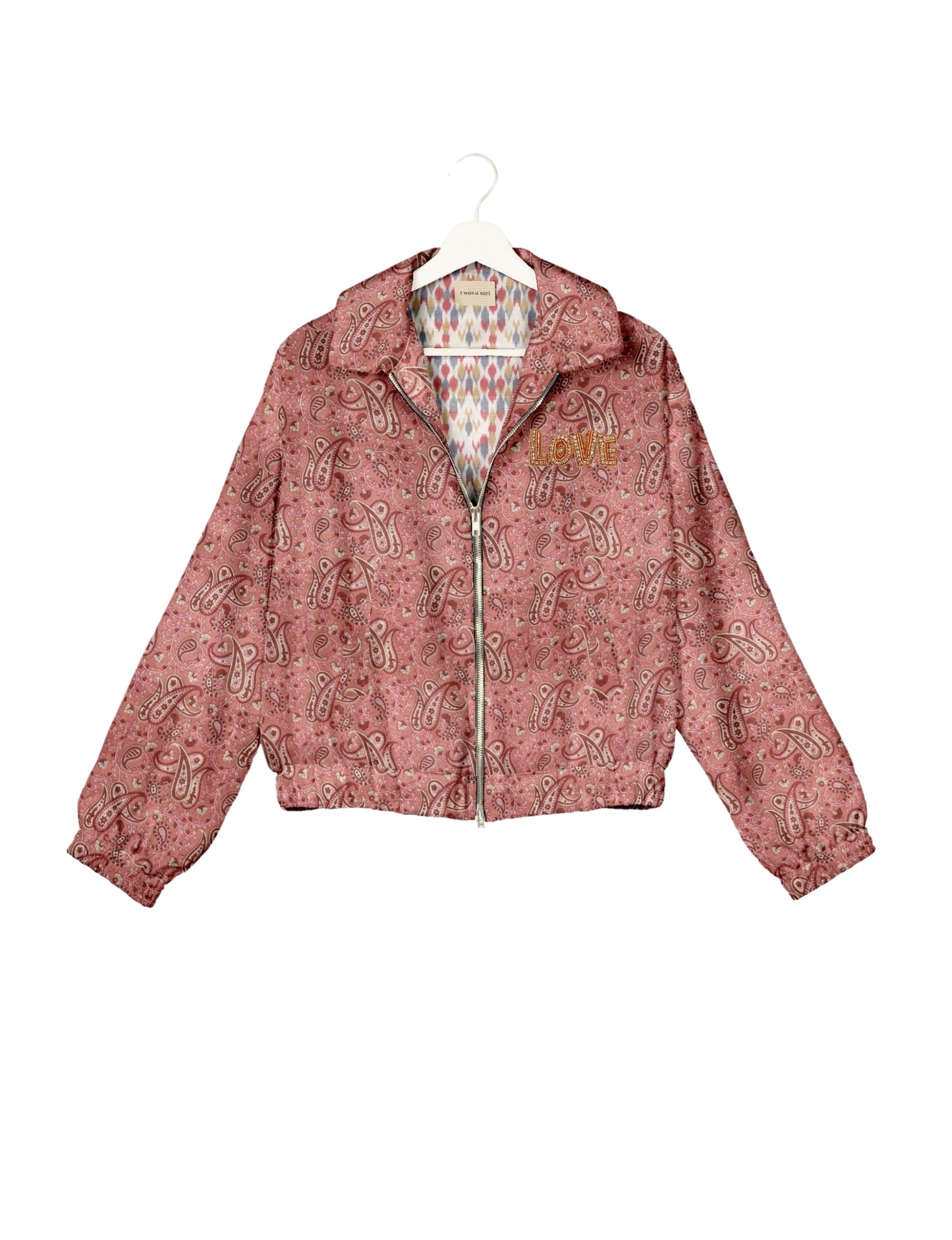 Love Bomber Jacket made from recycled fabric, featuring hand-stitched Aari embroidery. A unique piece of zero-waste clothing, part of the circular fashion movement. Designed with upcycled materials for a stylish yet environmentally friendly clothing choice.