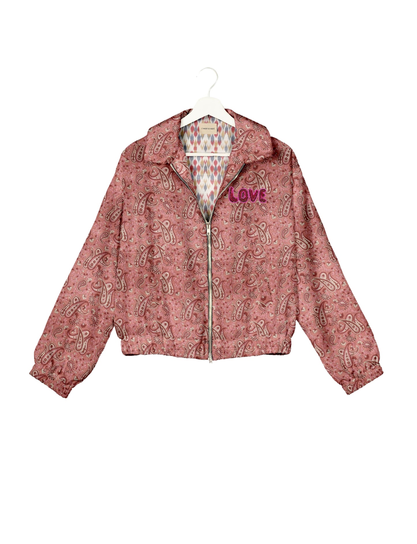 Love Bomber Jacket made from recycled fabric, featuring hand-stitched Aari embroidery. A unique piece of zero-waste clothing, part of the circular fashion movement. Designed with upcycled materials for a stylish yet environmentally friendly clothing choice.