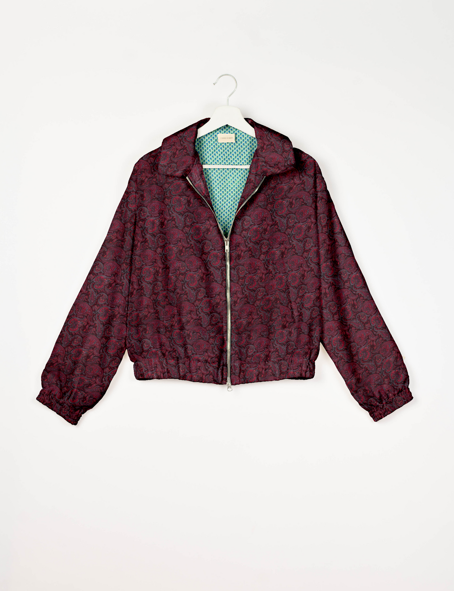 Upcycled Bomber Jacket made from recycled sari materials, featuring a cute cropped shape, elasticated hem and cuffs, and contrast sari print lining. Sustainable apparel promoting eco-friendly fashion and ethical clothing.